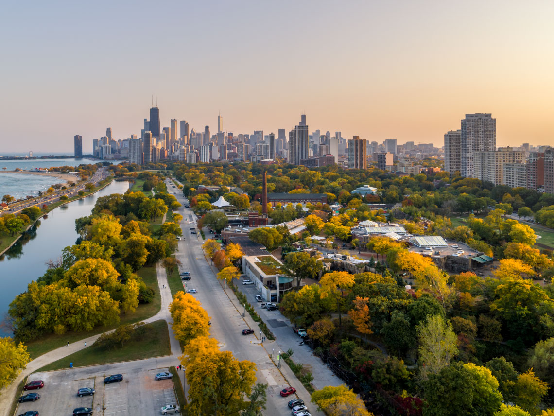Photo of Lincoln Park and the Chicago skyline at sunset.