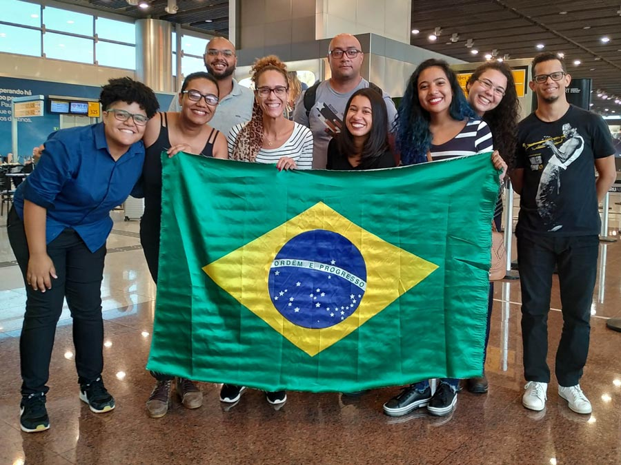 Black in AI members from Brazil display the nation's flag