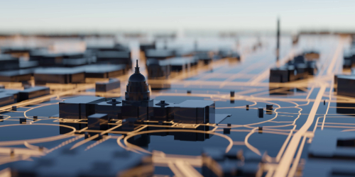 A futuristic, miniature cityscape with illuminated streets and prominent domed and obelisk-like structures.
