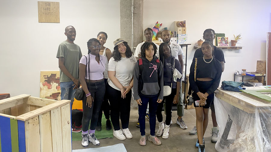 A group of young people pose for a photo.