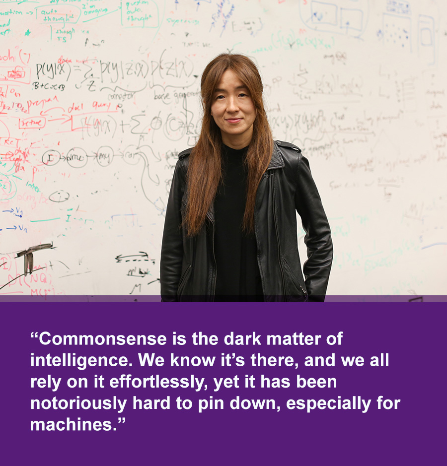 An Asian woman in black jacket stands in front of white board covered with mathematical equasions