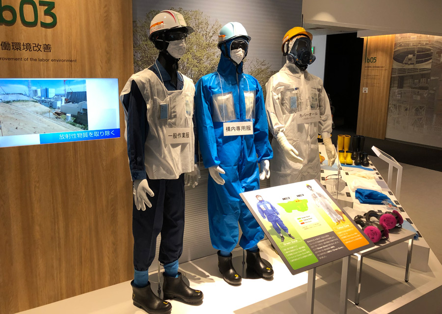 Exhibition_With_Protective_Gear_Worn_By_Workers_At_Fukushima