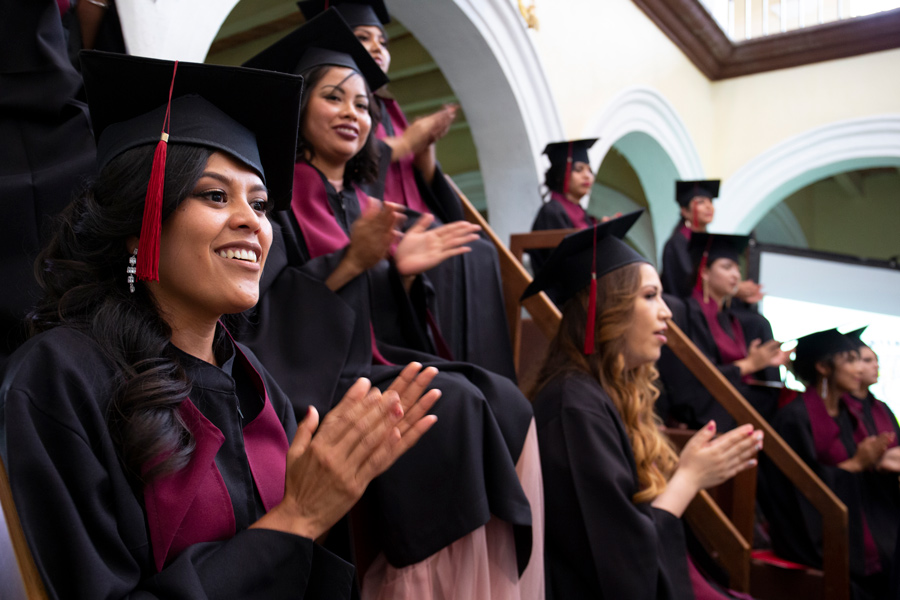 Group_Of_Mexican_Women_In_Caps_And_Gowns_Smiling_And_Clapping