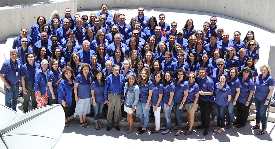 LargeGroupOfPeopleAllWearingBlueShirts