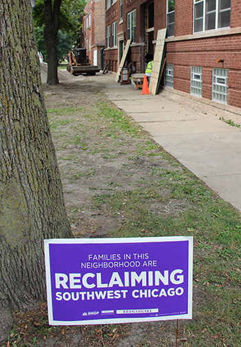 ReclaimingSouthwestChicagosigninfrontofbuilding