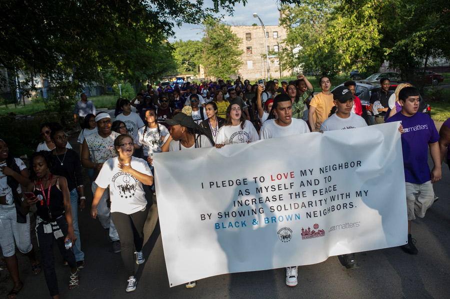 ResurrectionProjectgatheringofcommunitymarchinginthestreet