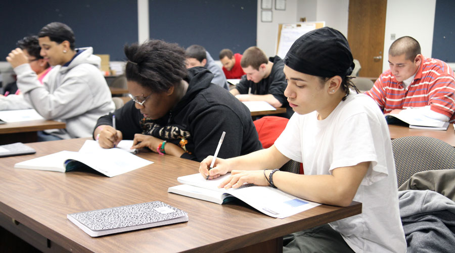 Classroom Of Students Studying And Working On Homework