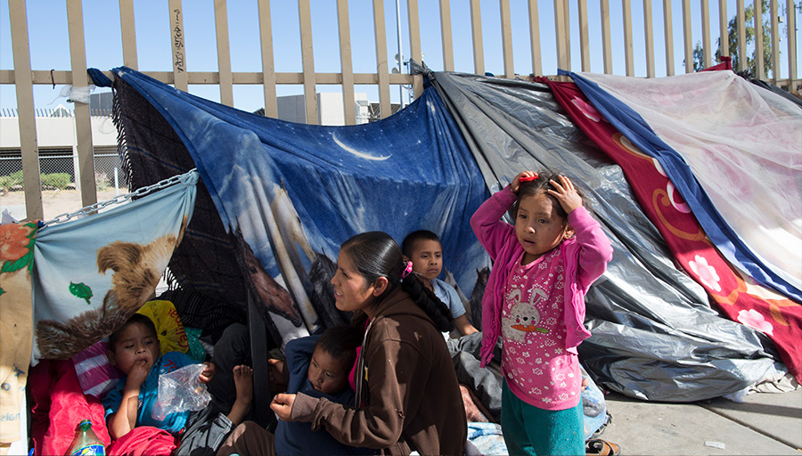 Mexican Mother With Children Make shift Tent At Mexico/US Border