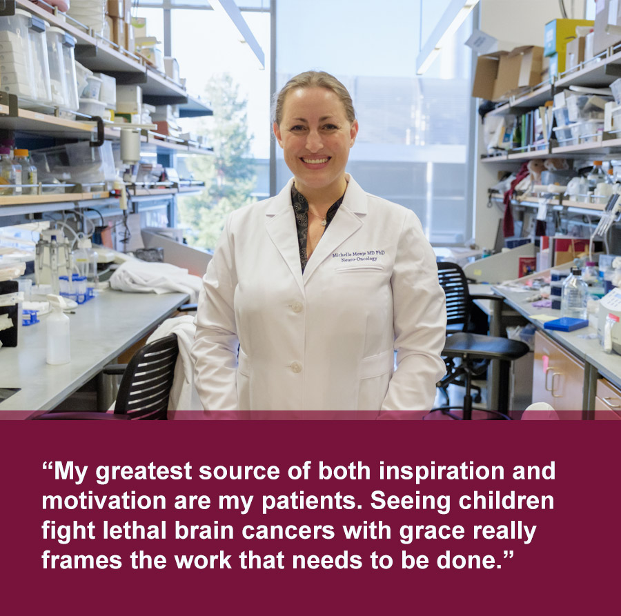 Smiling white woman with blonde hair wearing a white lab coat stands in room with medical equipment. Quote text below photo reads: My greatest source of both inspiration and motivation are my patients. Seeing children fight lethal brain cancers with grace really frames the work that needs to be done.