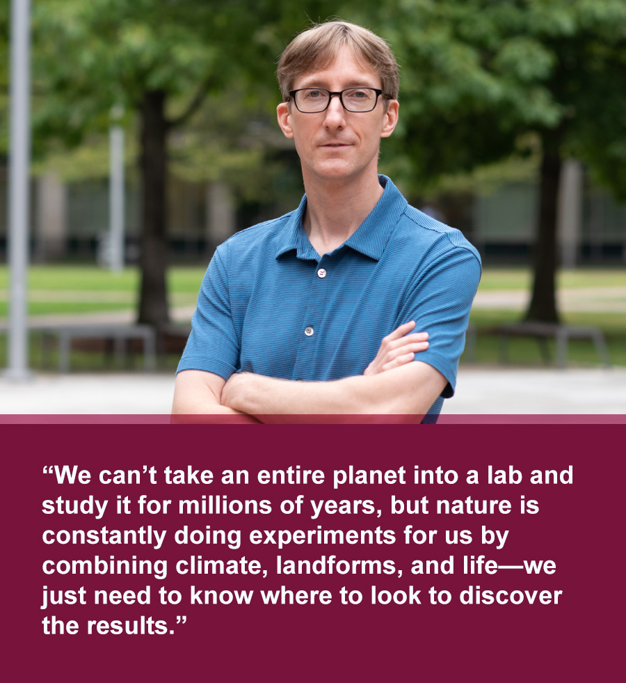 Middle aged white man with blonde hair and black framed glasses wearing a blue shirt with trees in background. Quote text below photo reads: We can’t take an entire planet into a lab and study it for millions of years, but nature is constantly doing experiments for us by combining climate, landforms, and life—we just need to know where to look to discover the results.