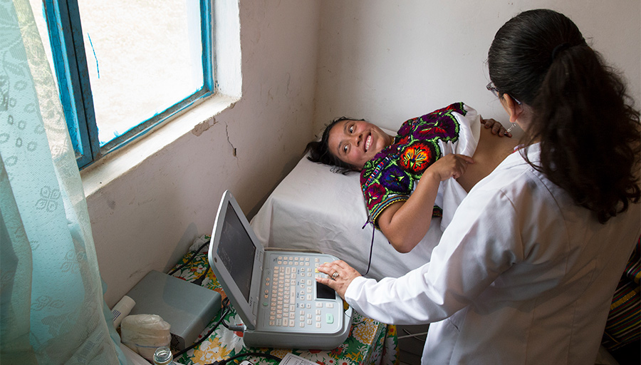 Happy Pregnant Woman Receiving Medical Exam