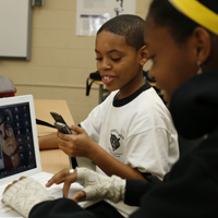 You Media Chicago Public Library Boy with Cell Phone, Laptop