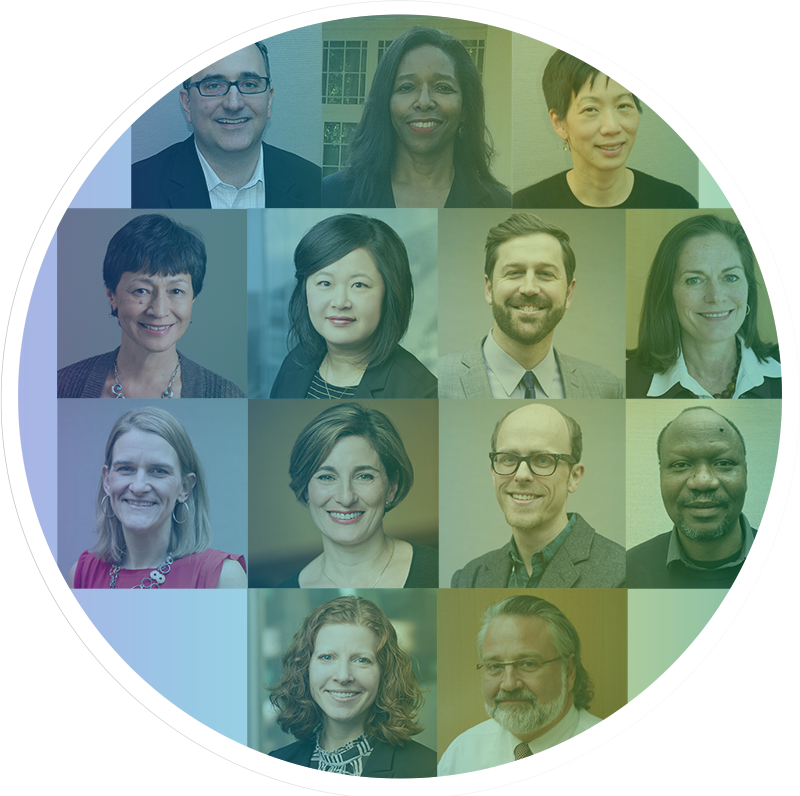 Group of people at a rally, young woman holding a handmade sign with Climate Justice and a flower