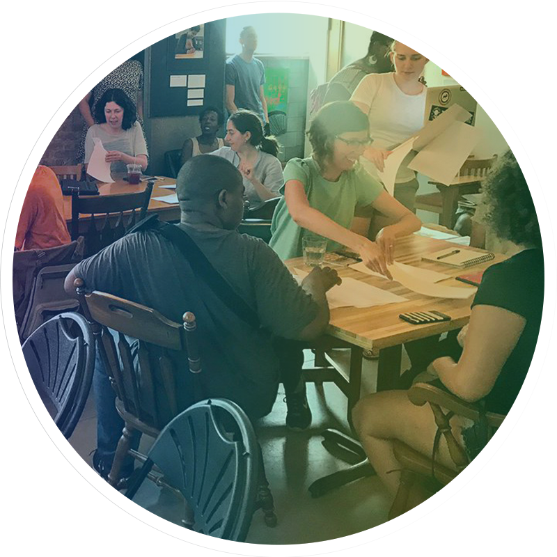 group of people at a table collaborating together