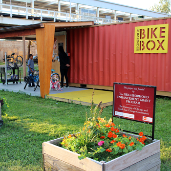 Small building next to train tracks for bike program